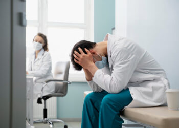 a person sitting in psyc ward / mental hospital